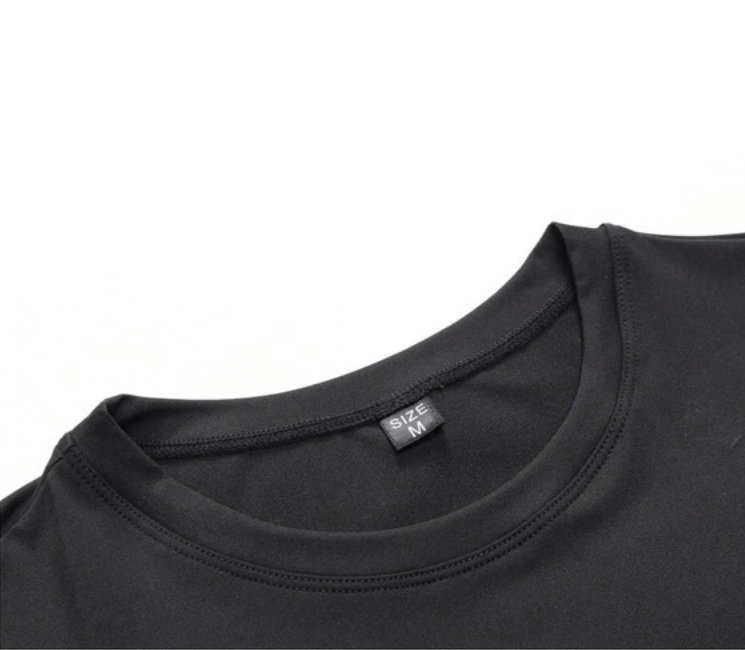 Close-up of black Lightweight Sports Compression Men's Shirt SF0465, made from breathable polyester and spandex, featuring quick-dry properties.